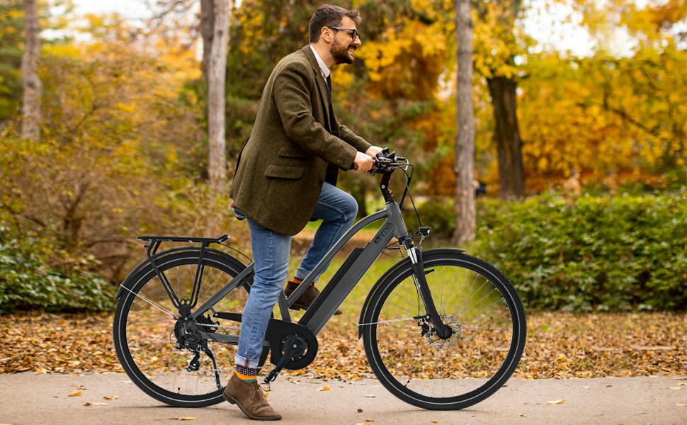 Rider on the AsVIVA B15 City E-Bike 28-inch in gray