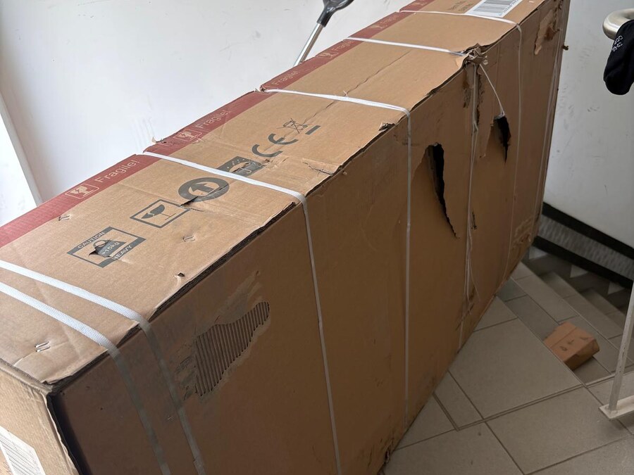 How the packaging may arrive: torn on the outside.