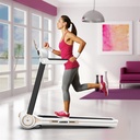 Person walking on the compact AsVIVA Walking Pad treadmill T211 in the living room